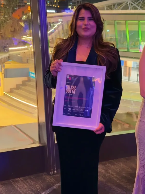 Dilsee Dutta holding her 40 Under 40 award