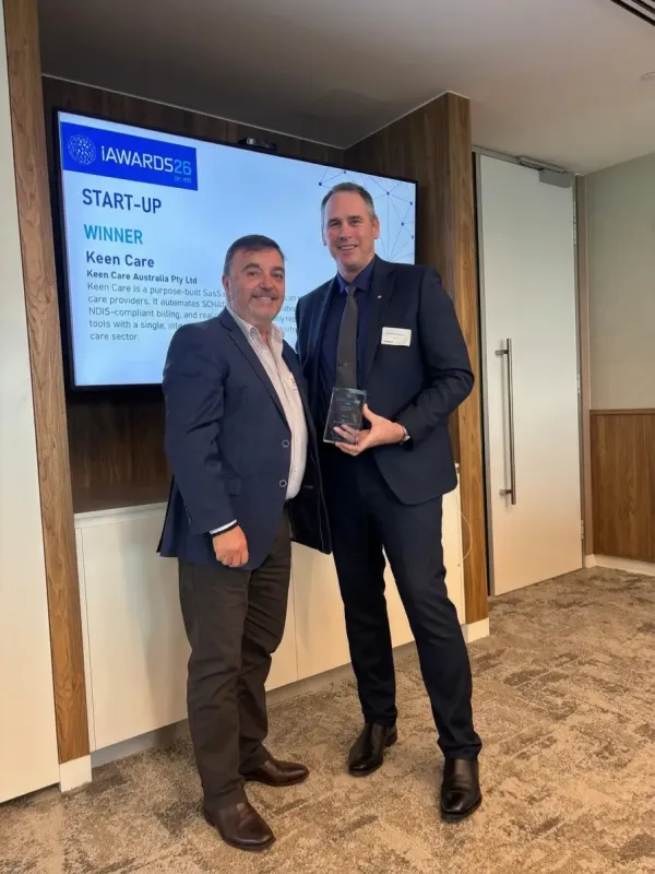 Keen Care receiving the iAwards startup winner trophy